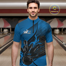 Load image into Gallery viewer, Male model at a bowling lane wearing a black and blue bowling quarter-zip shirt with bowling strike artwork and hexagonal pattern details.