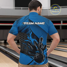 Load image into Gallery viewer, Front view of a male model in a bowling center wearing a black and blue quarter-zip shirt featuring a flaming bowling ball knocking down pins.