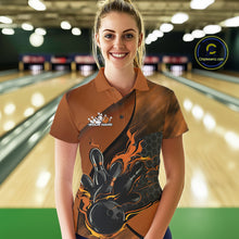 Load image into Gallery viewer, Female model wearing a black and orange bowling polo shirt at a bowling lane with fiery bowling action artwork and geometric accents.