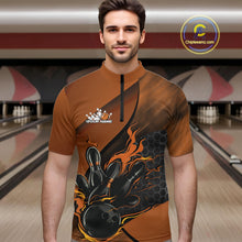 Load image into Gallery viewer, Male model wearing a black and orange bowling quarter-zip shirt at a bowling lane with fiery bowling action artwork and geometric accents.