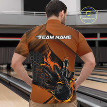 Load image into Gallery viewer, Front view of a male model in a bowling venue wearing a black and orange quarter-zip shirt featuring a flaming bowling ball and pin graphics.