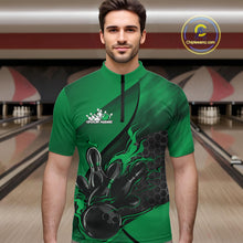Load image into Gallery viewer, Male model at a bowling lane wearing a black and green bowling quarter-zip shirt with flame bowling strike artwork and hexagonal graphics.