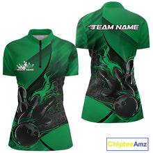 Load image into Gallery viewer, Women’s quarter zip bowling shirt mockup showcasing black and green shirt with flame bowling ball striking pins artwork and hexagon pattern accents