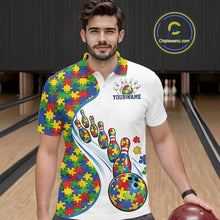 Load image into Gallery viewer, Male model in a bowling lane wearing a white polo shirt, front view featuring vibrant autism bowling strike design with puzzle details