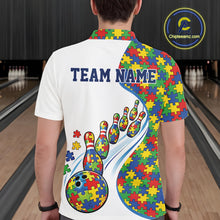 Load image into Gallery viewer, Male model at a bowling lane, back view of white polo shirt showcasing colorful autism bowling strike illustration with puzzle graphics