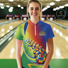 Load image into Gallery viewer, Female model in a bowling lane wearing a colorful quarter-zip shirt, autism puzzle bowling ball with matching trailing bowling pins in vibrant design.