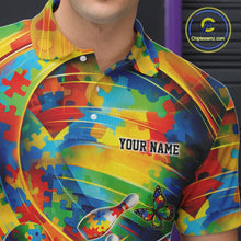 Load image into Gallery viewer, Close-up left chest detail of colorful bowling polo shirt featuring autism puzzle ribbon and bowling-themed emblem design