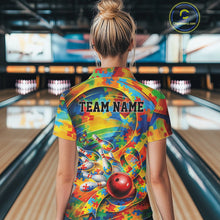 Load image into Gallery viewer, Female model in a bowling venue, back view of colorful polo shirt featuring autism puzzle bowling motif with vibrant tones