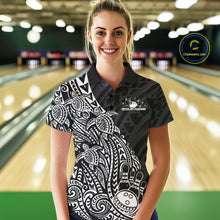 Load image into Gallery viewer, Female model wearing a black and white bowling polo shirt at the lane with turtle-inspired bowling graphics.