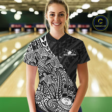 Load image into Gallery viewer, Female model wearing a black and white bowling quarter-zip shirt at the lane with tribal swirl bowling artwork.