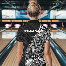 Load image into Gallery viewer, Back view of a female model in a black and white bowling quarter-zip shirt displaying Polynesian-inspired bowling graphics.