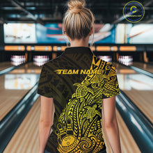 Load image into Gallery viewer, Back view of a female model in a black and gold bowling quarter-zip shirt featuring tribal-inspired bowling motifs.