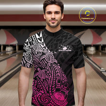 Load image into Gallery viewer, Male model wearing a black and pink bowling quarter-zip shirt at the lane with Polynesian-inspired bowling motifs.