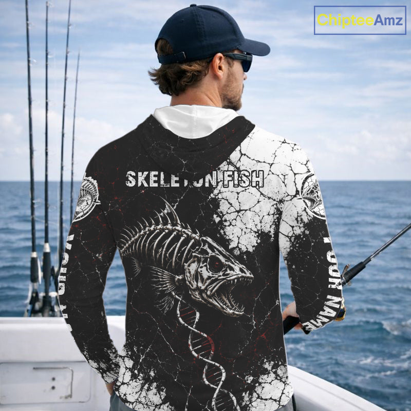 Man on a boat wearing a black and white long-sleeve shirt with 'Skeleton Fish' design, looking out at the ocean.