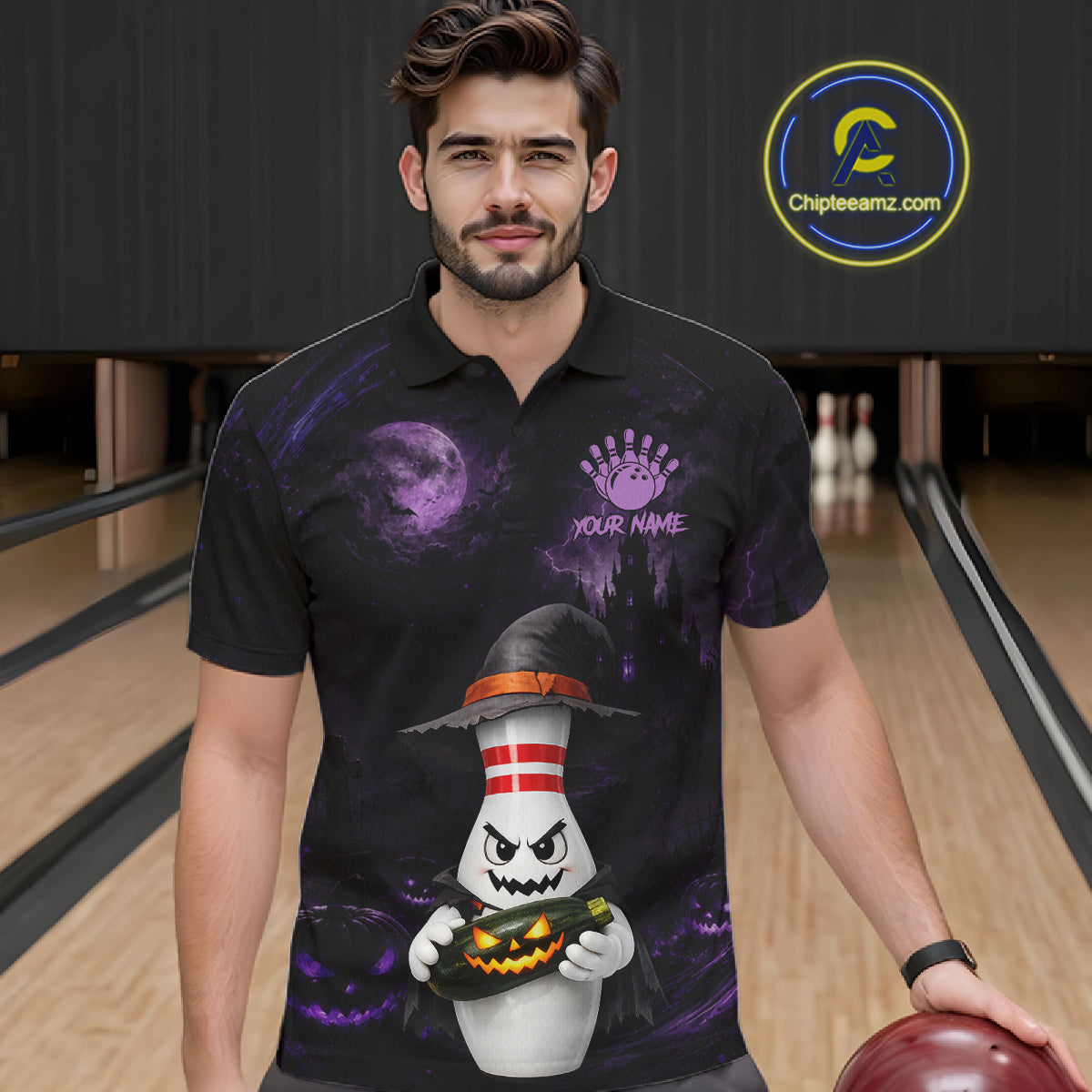 A man wearing a black short-sleeve polo shirt with a Halloween-themed graphic print featuring a ghost character holding a jack-o'-lantern, set against a bowling alley background. A circular 'Chipteeamz