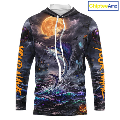 A long-sleeve hoodie with a detailed Halloween-themed graphic print featuring a marlin jumping from stormy waters under a large full moon, with orange text down the sleeves and a pumpkin jack-o'-lantern near the hem. The hoodie is shown on a plain white background with a 'ChipteeAmz' logo in the top right corner.
