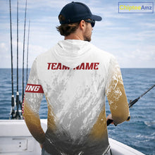 Load image into Gallery viewer, Man wearing a hoodie with a fish design and 'Fish Your Name' text, standing on a boat with ocean background.