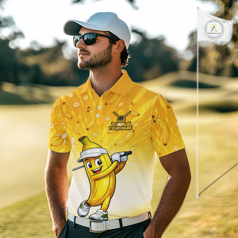 Man wearing a yellow golf shirt with a cartoon banana character on a golf course