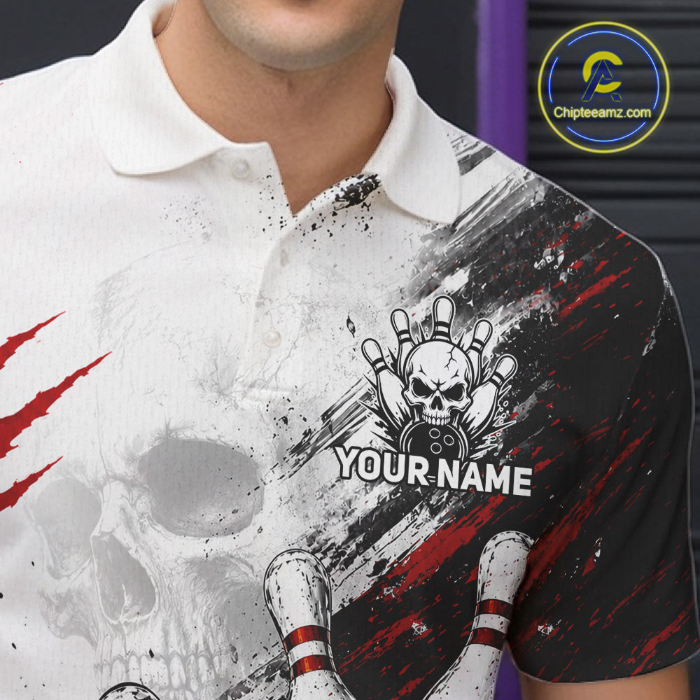 A close-up of a custom short-sleeve polo shirt featuring a white skull and bowling pins graphic with red claw marks and black brushstroke details. The shirt has a placeholder text 'YOUR NAME' on the chest.