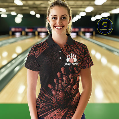 A woman wearing a custom short-sleeve polo shirt with a bowling-themed graphic print, standing in front of a blurred bowling alley background. The shirt features a black base with a reddish-brown hand and bowling ball design, and a white bowling pins graphic with the text 'YOUR NAME'.