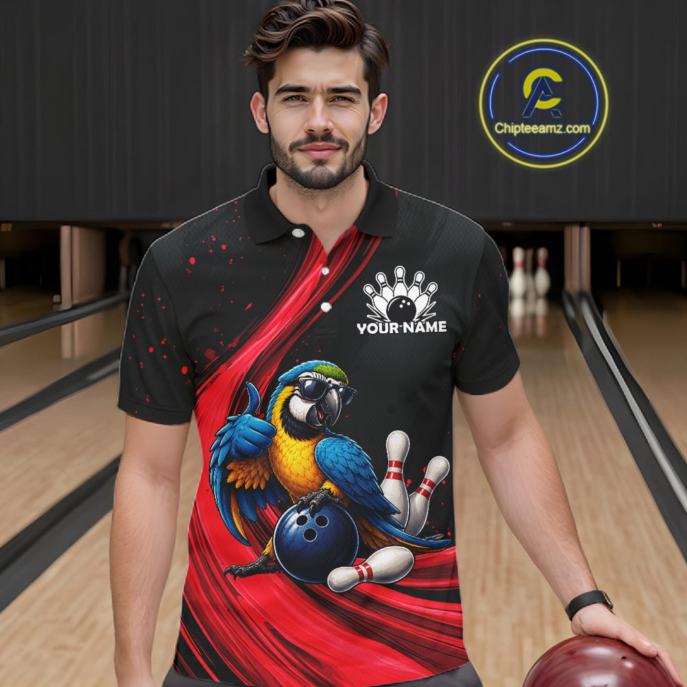 A man wearing a black and red bowling-themed polo shirt with a parrot graphic and bowling pins, standing in a bowling alley holding a bowling ball. A 'Chipteeamz.