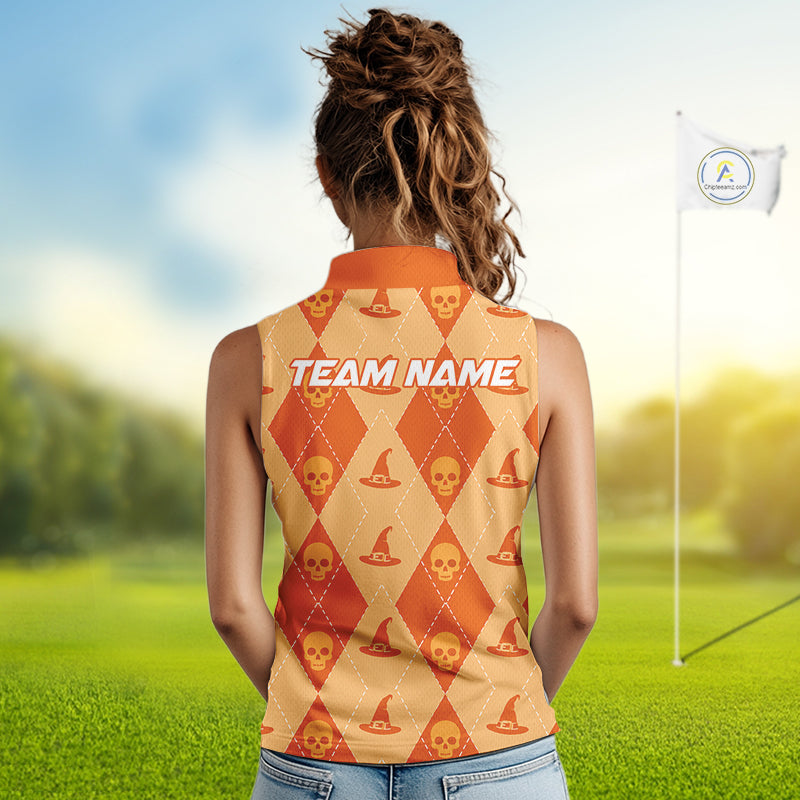 A woman viewed from behind wearing a sleeveless collared golf shirt with an orange and beige argyle pattern featuring skull and hat motifs, standing on a blurred golf course with a flag in the background.