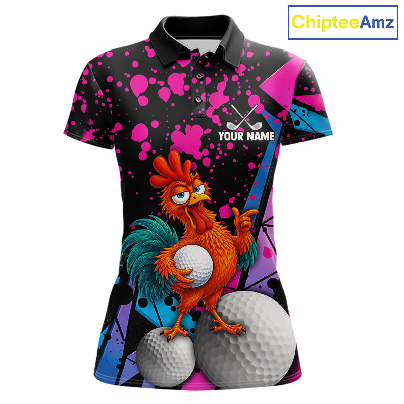 A custom printed short-sleeve polo shirt featuring a cartoon rooster holding golf balls on a black background with pink and blue paint splatters. The shirt includes a black collar and a customizable name patch on the chest.