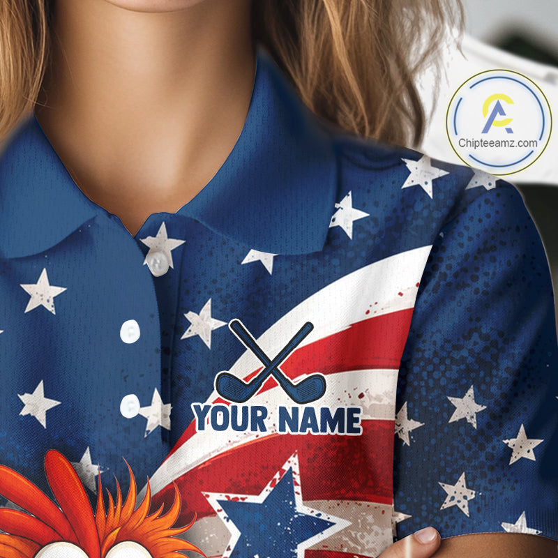 Close-up of a person wearing a short-sleeve polo shirt with a patriotic red, white, and blue design featuring stars, stripes, crossed hockey sticks, and the text 'YOUR NAME'.