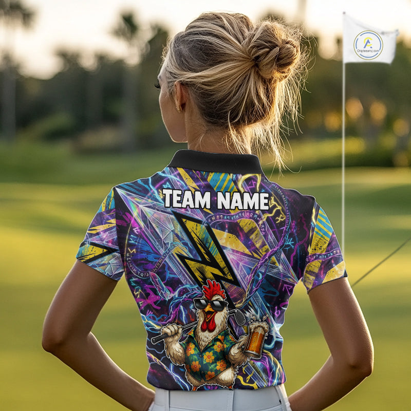 A woman viewed from behind on a golf course, wearing a short-sleeve collared polo shirt with a colorful abstract graphic print and a cartoon rooster on the back. The shirt has 'TEAM NAME' printed across the upper back, and a small white flag with a logo is visible in the background.