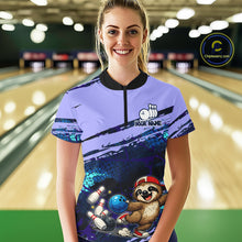 Load image into Gallery viewer, Person wearing a bowling-themed shirt with a sloth character in a bowling alley.