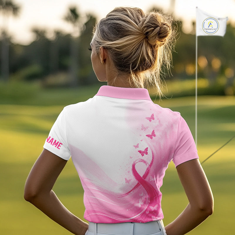 Woman in a pink and white golf shirt with butterfly design on a golf course