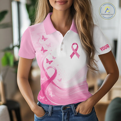 Woman wearing a pink and white polo shirt with a pink ribbon design and 'Your' text.