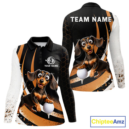 Front and back views of a long-sleeve polo shirt featuring a cartoon dachshund golf dog graphic on a black, orange, and white splatter design. The front shows a polo collar, 'YOUR NAME' placeholder text, and a golf ball graphic.