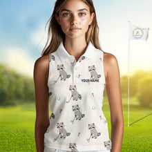 Load image into Gallery viewer, Woman wearing a sleeveless golf shirt with raccoon patterns on a golf course background