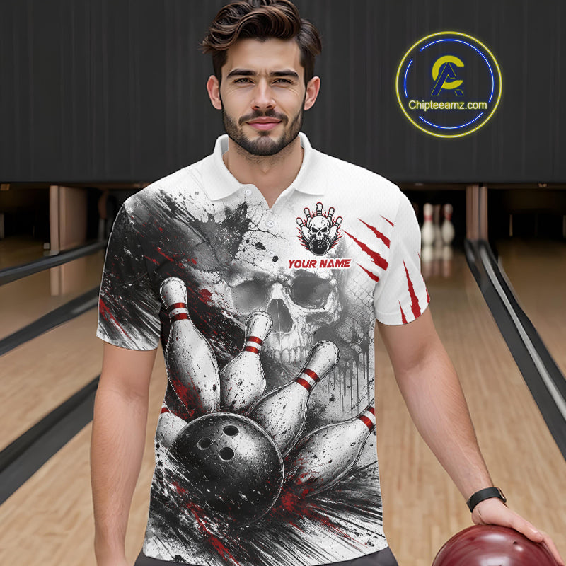 A man wearing a custom bowling-themed short-sleeve polo shirt with a skull and bowling pins graphic, standing in a bowling alley. The shirt features a white base with a black and red print and a customizable name patch on the chest.