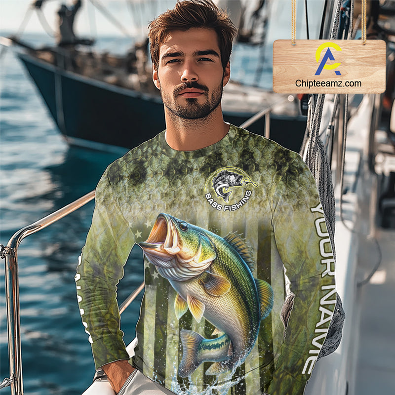 Man wearing a fishing-themed shirt with a large bass graphic on a boat 