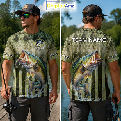 Man wearing a Bass fishing-themed t-shirt with a large mouth bass graphic, outdoors by water.