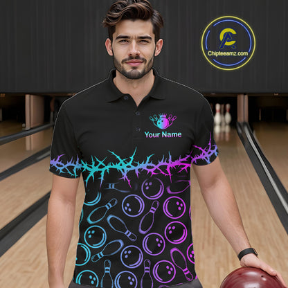 A man wearing a black short-sleeve polo shirt with a colorful bowling-themed print, standing in a bowling alley. The shirt features a neon cyan and purple thorn pattern across the chest and waist, with bowling pins and balls printed below.