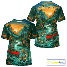 Load image into Gallery viewer, T-shirt with nature-themed design featuring a river, mountains, and fishing scene, branded 'Chiptee Amz'.