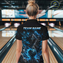 Load image into Gallery viewer, Person wearing a black t-shirt with a blue graphic design and 'TEAM NAME' text in a bowling alley.
