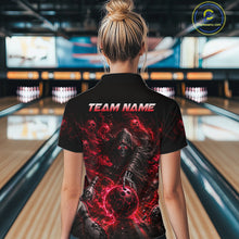 Load image into Gallery viewer, Person wearing a black t-shirt with a red and black design and 'TEAM NAME' text in a bowling alley.
