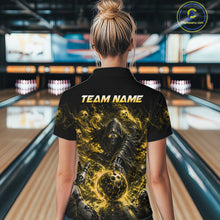 Load image into Gallery viewer, Person wearing a black t-shirt with a graphic design and 'TEAM NAME' text in a bowling alley.
