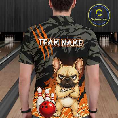 A person viewed from behind wearing a short-sleeve bowling shirt with a custom graphic of a French bulldog and bowling pins. The shirt features a dark camouflage pattern with orange claw marks and the text 'TEAM NAME'.