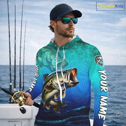 Teal and blue fishing-themed hoodie with a large mouth bass design on a white background.