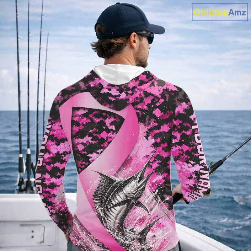 Angler wearing pink ribbon camouflage marlin fishing breast cancer long sleeve hooded sun protection shirt on the water - back view