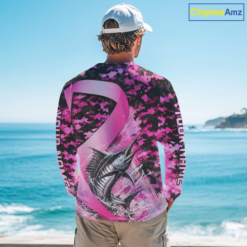 Angler wearing pink ribbon camouflage marlin fishing breast cancer long sleeve sun protection shirt on the water - back view