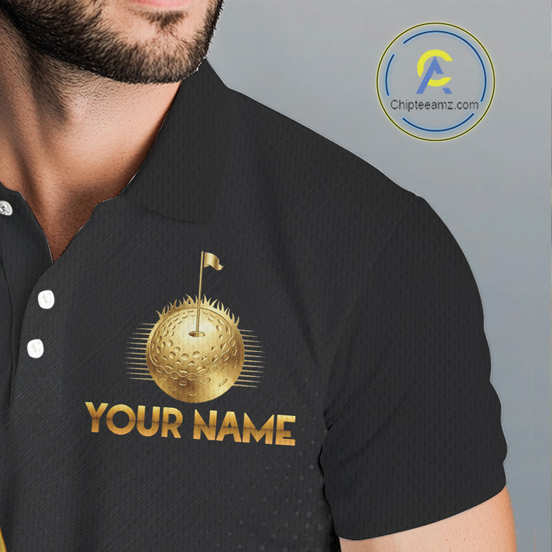 Closse-up fabric of black polo shirt with gold golf ball design and 'Your Name' text on the chest