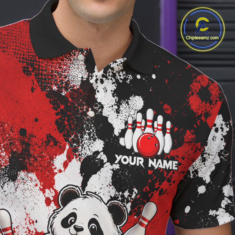 A close-up of a person wearing a short-sleeve polo shirt with a bold red, black, and white splatter graphic, a black collar