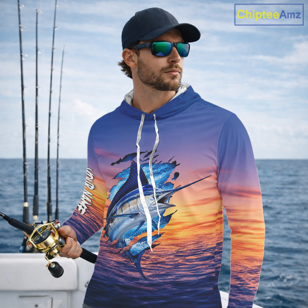 Angler wearing Marlin Fishing Sunset custom long sleeve hooded marlin offshore fishing shirt on the boat at sunset