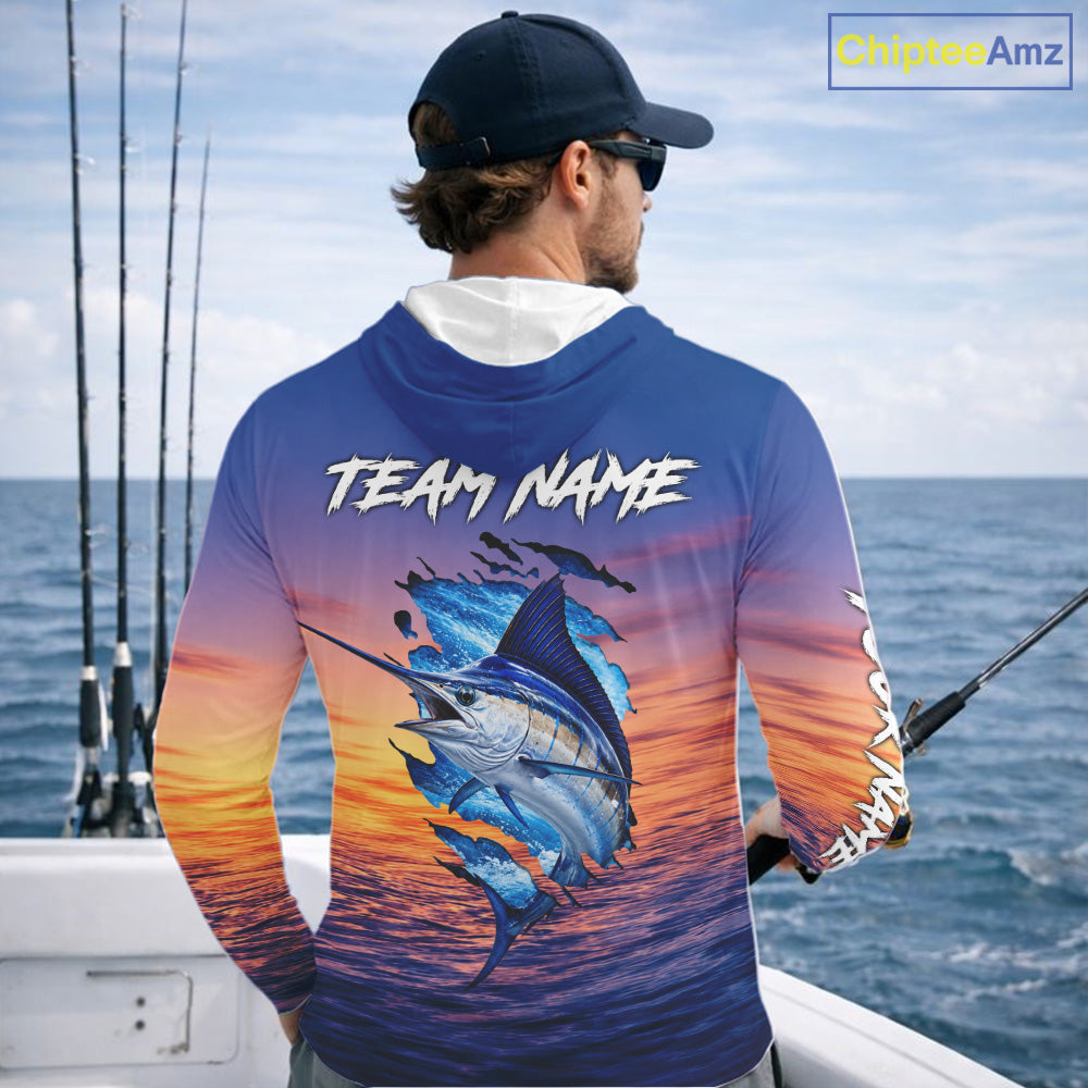 Angler wearing Marlin Fishing Sunset custom long sleeve hooded marlin offshore fishing shirt on the boat at sunset